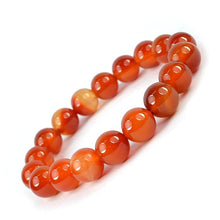 Load image into Gallery viewer, Model wearing a stylish Carnelian bracelet to highlight its elegance and aesthetic appeal. Get to know more about the Carnelian benefits