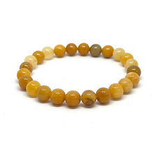 Load image into Gallery viewer, Model wearing a stylish Yellow Aventurine bracelet to highlight its elegance and aesthetic appeal. Get to know more about the Yellow Aventurine benefits