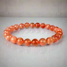 Load image into Gallery viewer, The Sunstone bracelet with a focus on its vibrant color and unique texture.