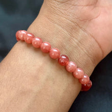Load image into Gallery viewer, Lifestyle shot of a Sunstone bracelet on a person's wrist, emphasizing comfort and beauty.