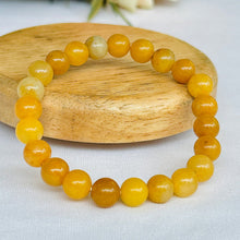 Load image into Gallery viewer, A collection of Yellow Aventurine bracelet showcasing different styles and sizes along with their Yellow Aventurine bracelet benefits.