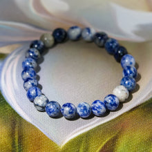 Load image into Gallery viewer, A collection of Sodalite bracelet showcasing different styles and sizes along with their Sodalite bracelet benefits.
