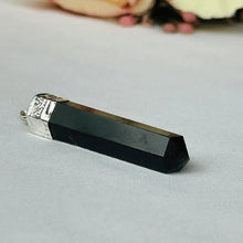Load image into Gallery viewer, Black onyx point crystal pendant with a silver cap and chain displayed on a clean white background.