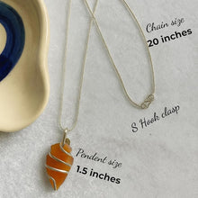 Load image into Gallery viewer, Polished carnelian crystal pendant on a metal chain for energy and creativity