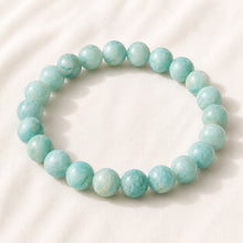 Load image into Gallery viewer, Amazonite Bracelet displayed fully on white silk cloth to show its natural colour, shape and finish