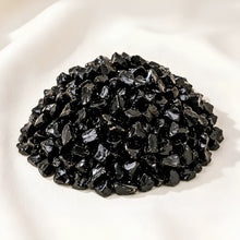 Load image into Gallery viewer, Black Obsidian Chips displayed fully on white silk cloth to show its natural colour, shape and finish