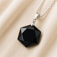 Load image into Gallery viewer, Close-up of authentic natural Black Tourmaline showing crystal texture, colour and craftsmanship – black tourmaline hexagon pendant symbol of guarding grounding