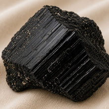 Load image into Gallery viewer, Close-up of authentic natural Black Tourmaline showing crystal texture, colour and craftsmanship – black tourmaline raw stone symbol of protection grounding and
