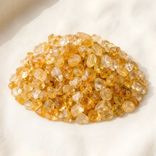 Load image into Gallery viewer, Citrine Chips displayed fully on white silk cloth to show its natural colour, shape and finish