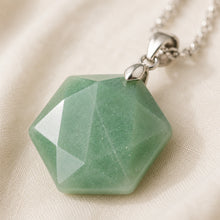 Load image into Gallery viewer, Close-up of authentic natural Green Aventurine showing crystal texture, colour and craftsmanship – green aventurine hexagon pendant symbol of luck longevity and