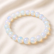 Load image into Gallery viewer, Opal Bracelet displayed fully on white silk cloth to show its natural colour, shape and finish