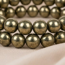 Load image into Gallery viewer, Close-up of authentic natural Pyrite showing crystal texture, colour and craftsmanship – pack of 2 pyrite bracelets wealth protection positivity energy evashu