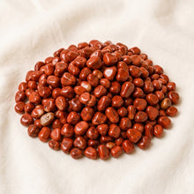 Load image into Gallery viewer, Red Jasper Chips displayed fully on white silk cloth to show its natural colour, shape and finish