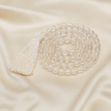 Load image into Gallery viewer, Sphatik Japmala 6mm Japmala displayed fully on white silk cloth to show its natural colour, shape and finish