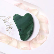 Load image into Gallery viewer, Green Jade Gua Sha tool for facial care, promoting cooling, renewing skin, and prosperity benefits.