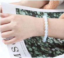 Load image into Gallery viewer, Positivity & Balance - Opal Bracelet for luminous everyday wear and inner harmony - Scale Reference | Natural Crystal Bracelet for Evil Eye Protection & Negative Energy Shield