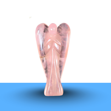 Load image into Gallery viewer, Rose Quartz Angel crystal figurine placed on a minimalist white and blue backdrop for love and healing.