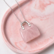 Load image into Gallery viewer, Rose Quartz Mini Handbag Pendant – Symbol of Love, Gentleness, and Comfort – Perfect for Daily Wear - Lifestyle View | Natural Rose Quartz, Seven Chakra Crystal Ring for Love & Relationship Harmony