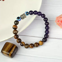 Load image into Gallery viewer, Strength & Protection - Tiger Eye, Amethyst, and Evil Eye Bracelet for unisex wear - On Hand View | Natural Amethyst, Tiger Eye, Evil Eye Crystal Bracelet for Evil Eye Protection & Negative Energy Shield