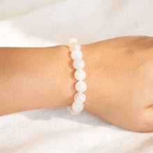 Load image into Gallery viewer, White Moonstone bead bracelet worn on a wrist in a close-up view