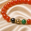 Close-up of Aries / Mesh Rashi Bracelet with 8 mm beads and diamond-cut front accents
