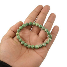 Load image into Gallery viewer, The Tree Agate bracelet with a focus on its vibrant color and unique texture.
