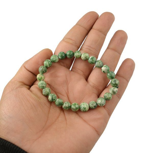 The Tree Agate bracelet with a focus on its vibrant color and unique texture.