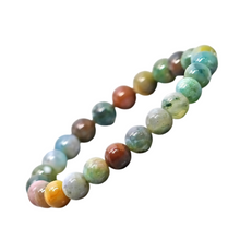 Load image into Gallery viewer, Model wearing a stylish Indian Agate bracelet to highlight its elegance and aesthetic appeal. Get to know more about the Indian Agate benefits
