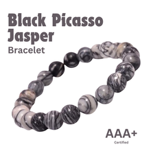 Load image into Gallery viewer, Close-up of Black Picasso Jasper bracelet showing intricate details and natural Black Picasso Jasper stone.
