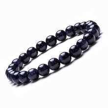 Load image into Gallery viewer, Model wearing a stylish Blue Sunstone bracelet to highlight its elegance and aesthetic appeal. Get to know more about the Blue Sunstone benefits
