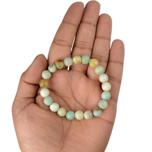 Load image into Gallery viewer, The Amazonite bracelet with a focus on its vibrant color and unique texture.
