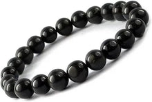 Load image into Gallery viewer, Model wearing a stylish Black Onyx bracelet to highlight its elegance and aesthetic appeal. Get to know more about the Black Onyx benefits
