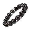 Model wearing a stylish Black Obsidian bracelet to highlight its elegance and aesthetic appeal. Get to know more about the Black Obsidian benefits