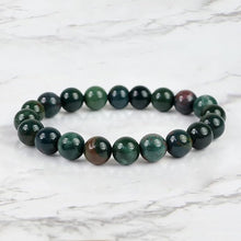 Load image into Gallery viewer, The Bloodstone bracelet with a focus on its vibrant color and unique texture.

