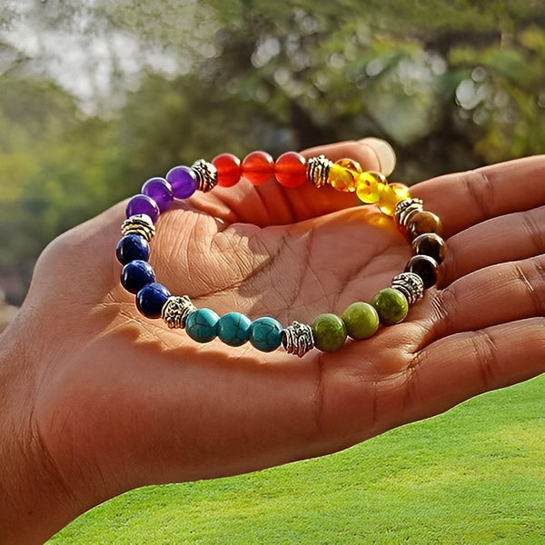 A collection of 7 chakra bracelet showcasing different styles and sizes along with their 7 chakra bracelet benefits.