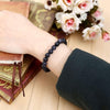 Lifestyle shot of a Blue Sunstone bracelet on a person's wrist, emphasizing comfort and beauty.