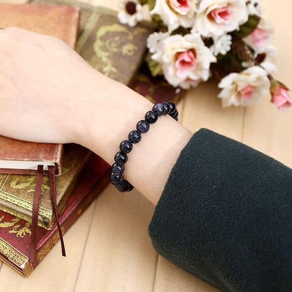 Lifestyle shot of a Blue Sunstone bracelet on a person's wrist, emphasizing comfort and beauty.