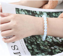 Load image into Gallery viewer, The Opal bracelet with a focus on its vibrant color and unique texture.
