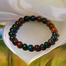 Load image into Gallery viewer, A collection of Bloodstone bracelet showcasing different styles and sizes along with their Bloodstone bracelet benefits.
