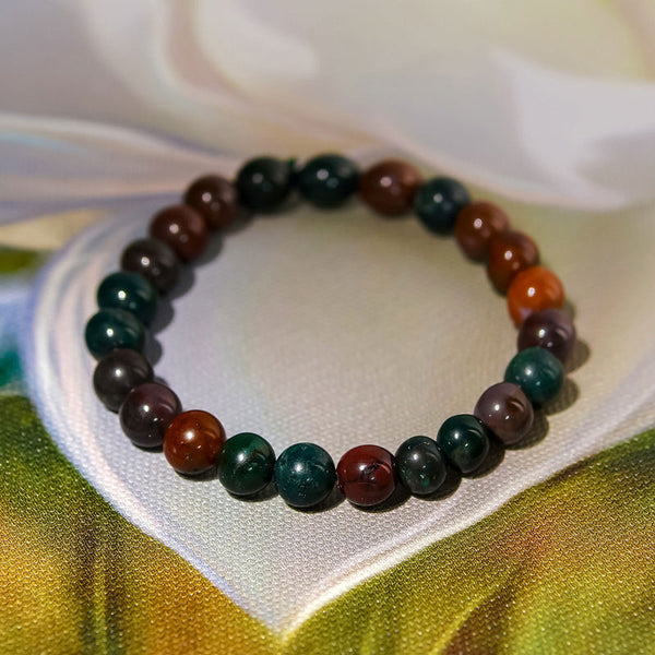 A collection of Bloodstone bracelet showcasing different styles and sizes along with their Bloodstone bracelet benefits.