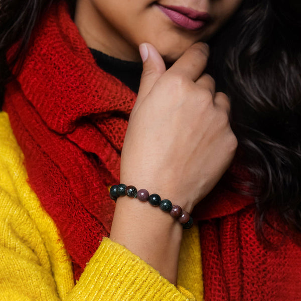 Lifestyle shot of a Bloodstone bracelet on a person's wrist, emphasizing comfort and beauty.