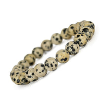 Load image into Gallery viewer, Model wearing a stylish Dalmation Jasper bracelet to highlight its elegance and aesthetic appeal. Get to know more about the Dalmation Jasper benefits
