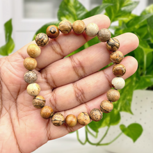 Load image into Gallery viewer, A collection of Picture Jasper bracelet showcasing different styles and sizes along with their Picture Jasper bracelet benefits.
