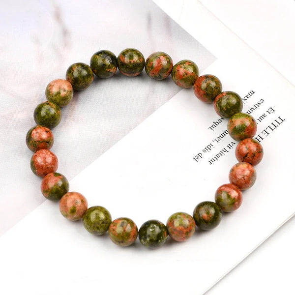 The Unakite bracelet with a focus on its vibrant color and unique texture.