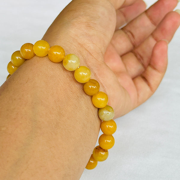 Lifestyle shot of a Yellow Aventurine bracelet on a person's wrist, emphasizing comfort and beauty.