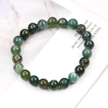 Load image into Gallery viewer, A collection of Moss Agate bracelet showcasing different styles and sizes along with their Moss Agate bracelet benefits.
