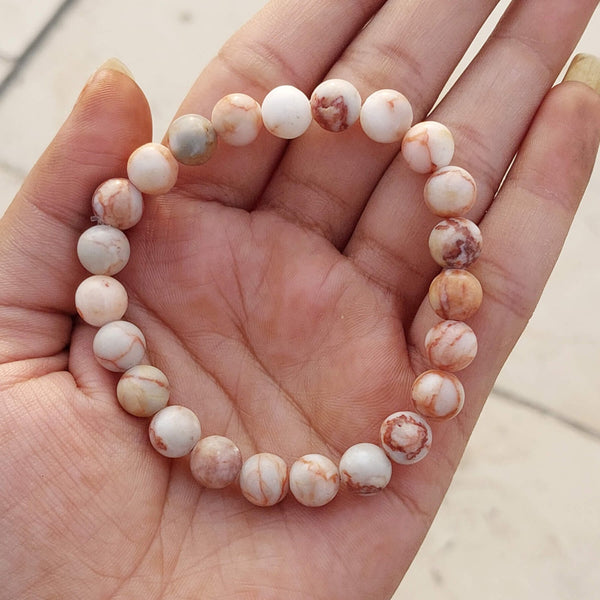 A collection of Red Picasso Jasper bracelet showcasing different styles and sizes along with their Red Picasso Jasper bracelet benefits.