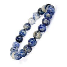 Load image into Gallery viewer, Model wearing a stylish Sodalite bracelet to highlight its elegance and aesthetic appeal. Get to know more about the Sodalite benefits
