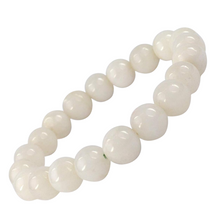 Load image into Gallery viewer, Model wearing a stylish White Agate bracelet to highlight its elegance and aesthetic appeal. Get to know more about the White Agate benefits
