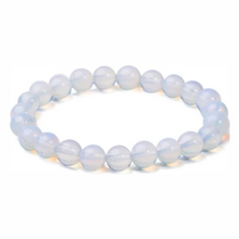 Load image into Gallery viewer, Model wearing a stylish Opal bracelet to highlight its elegance and aesthetic appeal. Get to know more about the Opal benefits
